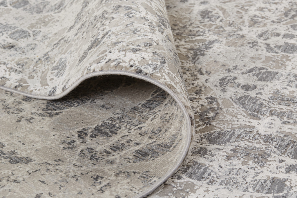 3' X 5' Ivory Taupe and Gray Oriental Power Loom Area Rug With Fringe