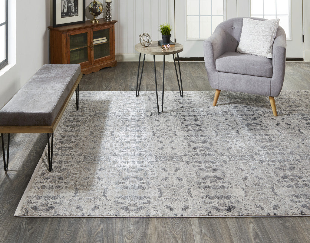 3' X 5' Ivory Taupe and Gray Oriental Power Loom Area Rug With Fringe