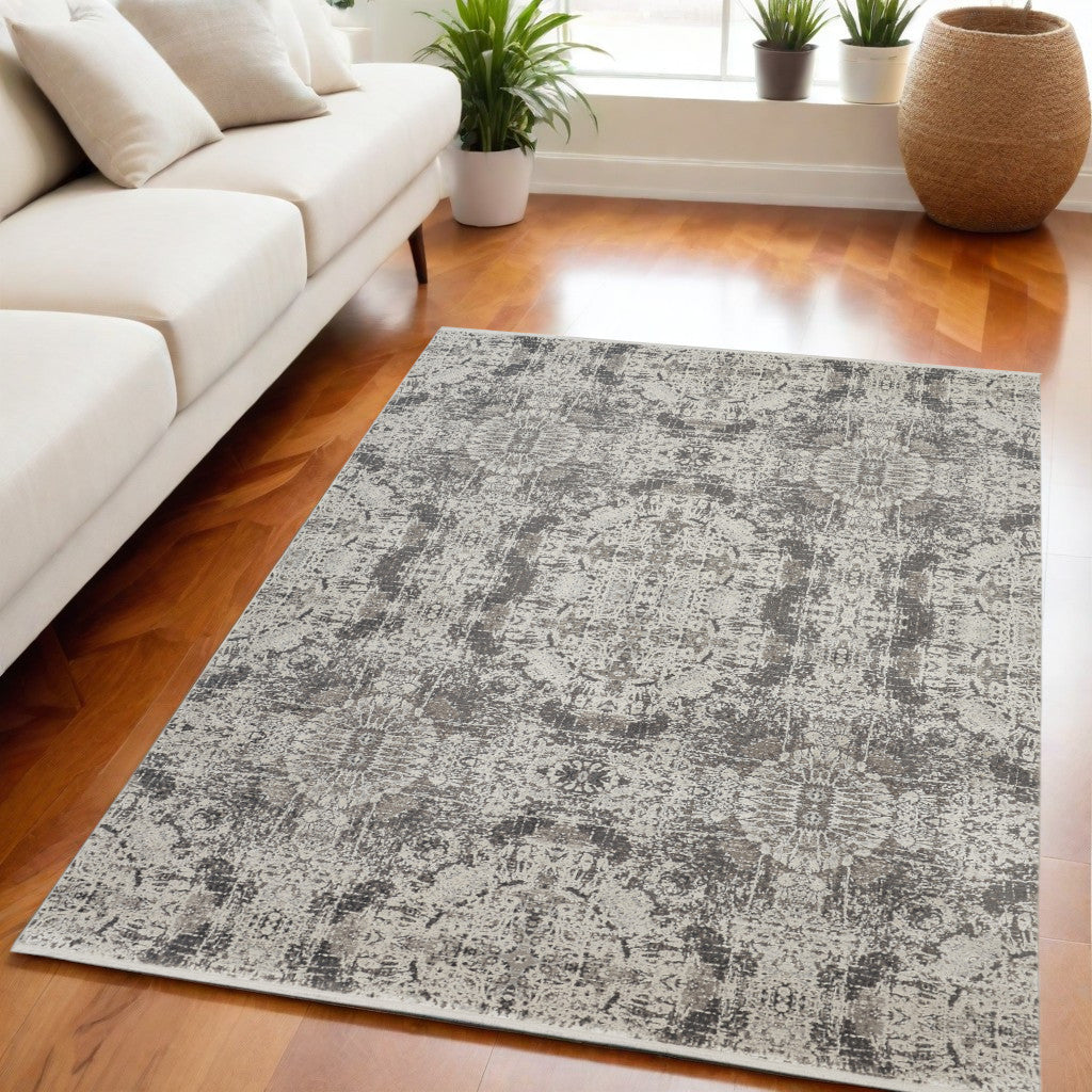 3' X 5' Ivory Taupe and Gray Oriental Power Loom Area Rug With Fringe