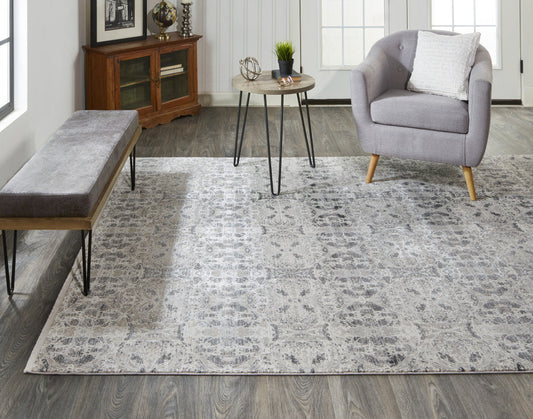 3' X 5' Ivory Taupe and Gray Oriental Power Loom Area Rug With Fringe