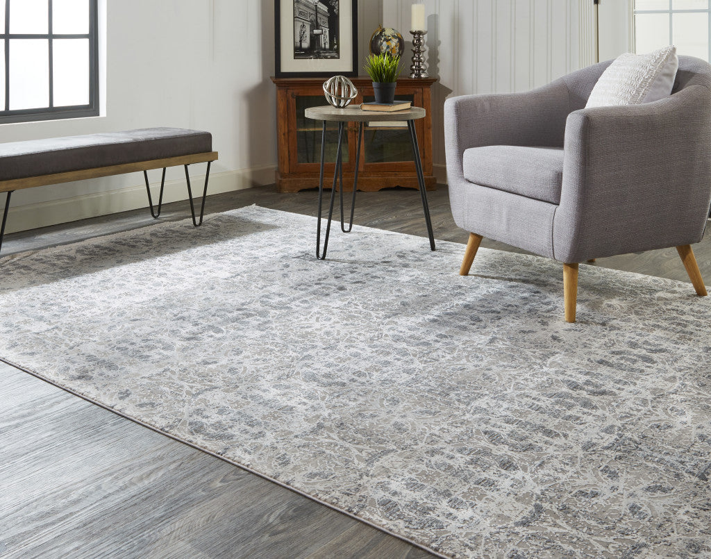 3' X 5' Ivory Taupe and Gray Oriental Power Loom Area Rug With Fringe